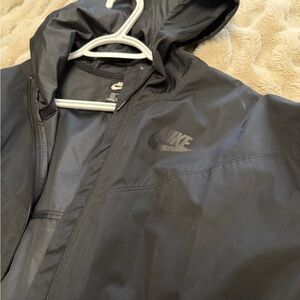 Nike Women's Utility Long Rain  Jacket in Black